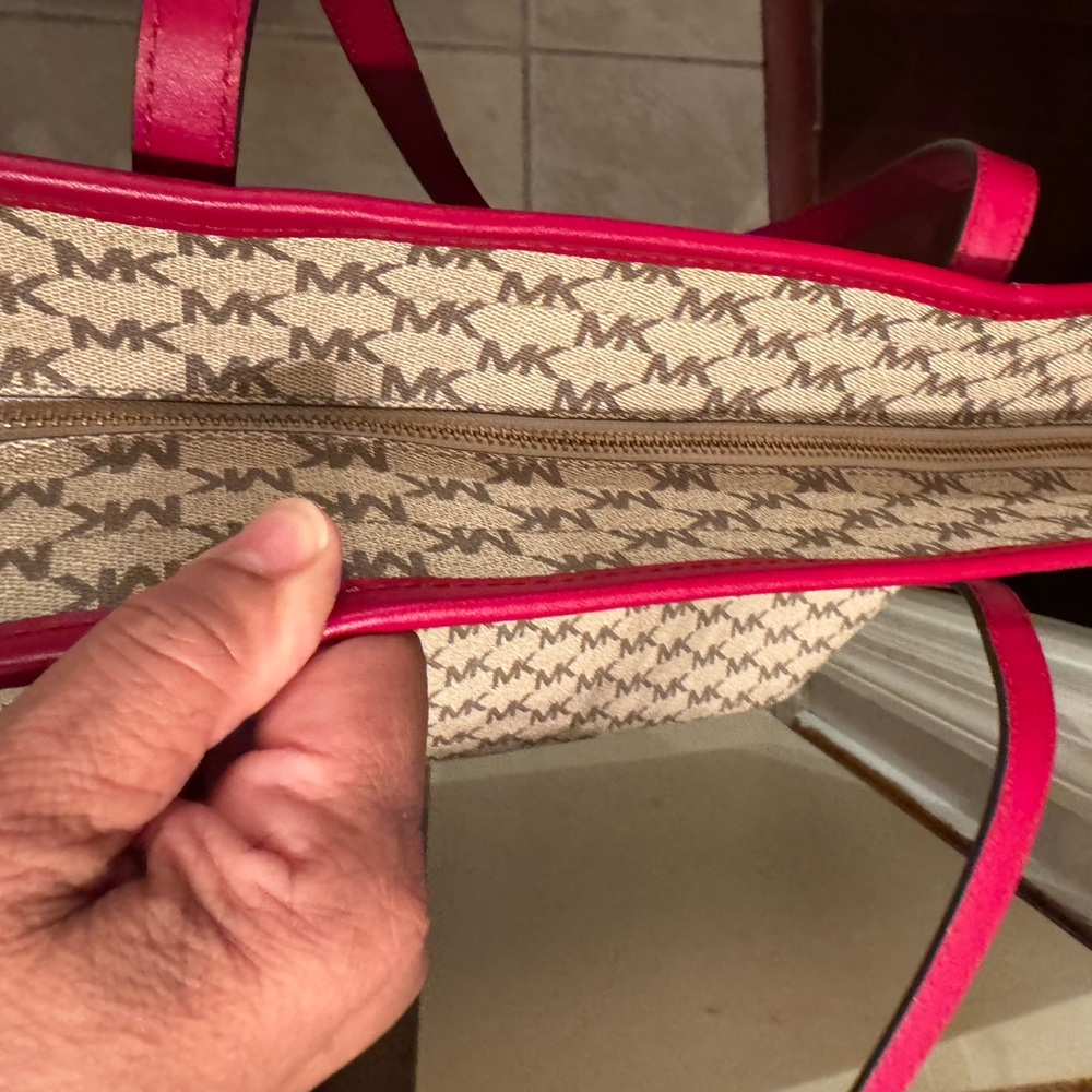 Michael Kors tote 19 length 11 wide zippered closures outside and out. 3 inside - Picture 7 of 11